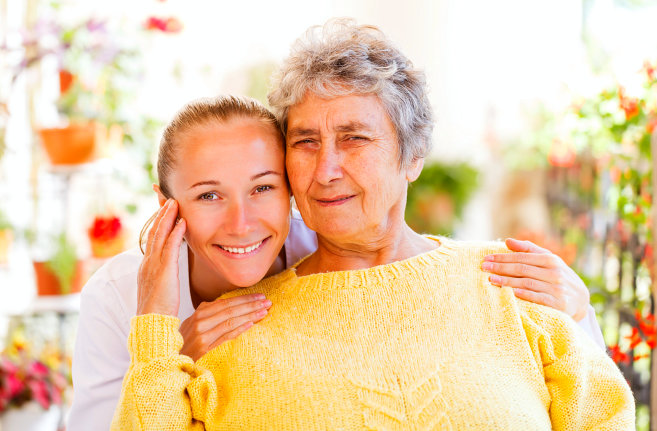 elderly woman with caregiver