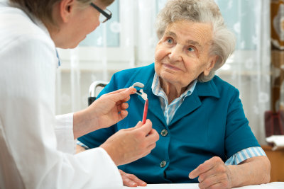 deaf senior woman during a hearing test